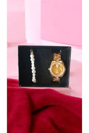 gold parlak taşlı saat ve karanlıkta paralayan bileklik